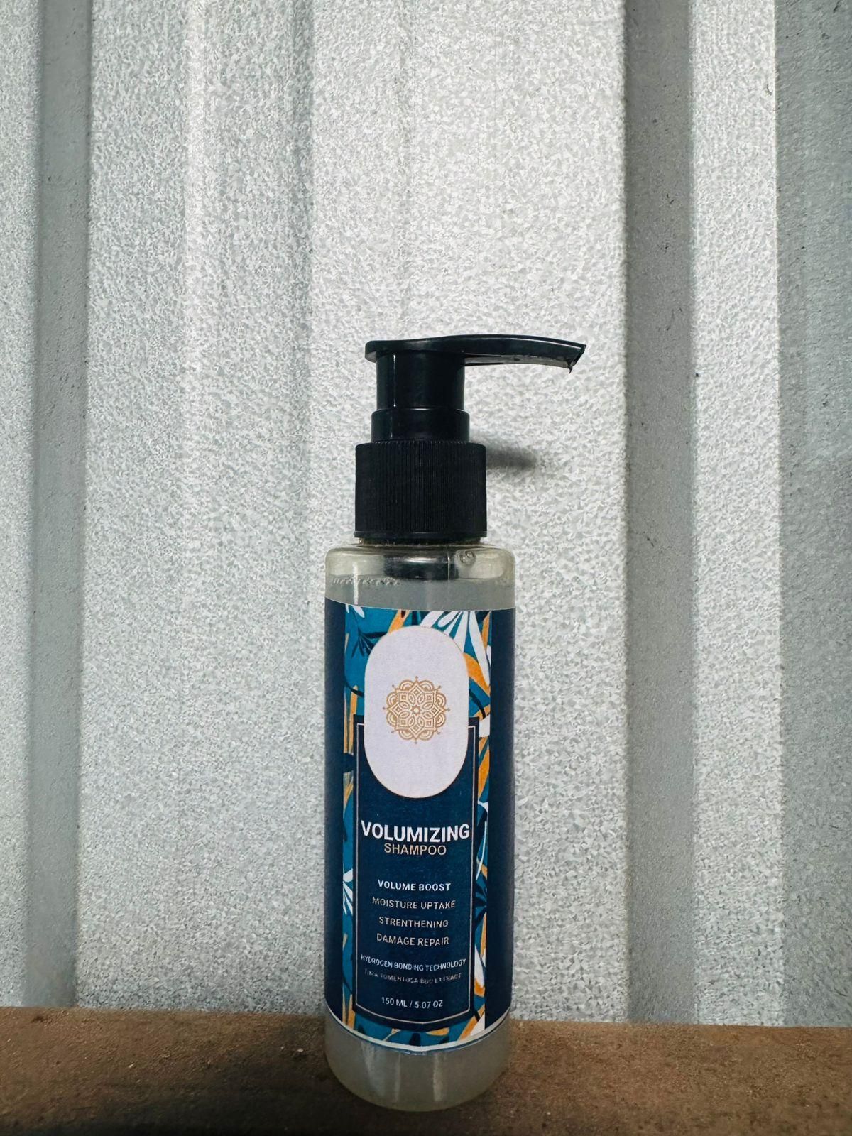 Bottle of volumizing shampoo with pump on a textured gray background