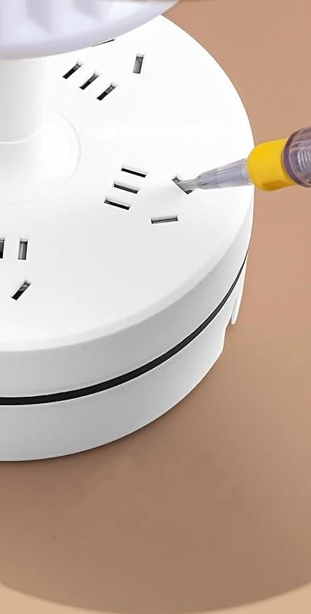White smoke detector with a screwdriver on a brown surface