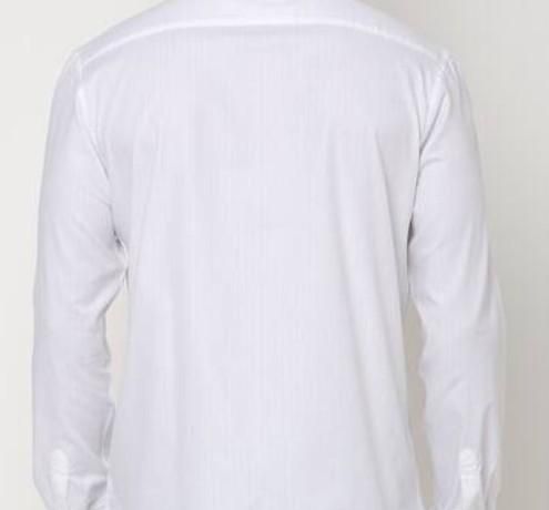 White long-sleeve shirt on a light beige background