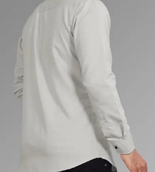 Light gray long-sleeve shirt on a gray background
