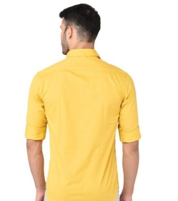 Man wearing a yellow shirt from behind on a white background