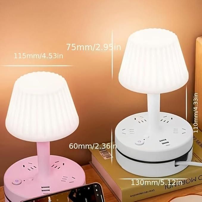 Two table lamps, one pink and one white, with measurements indicated on a wooden surface.