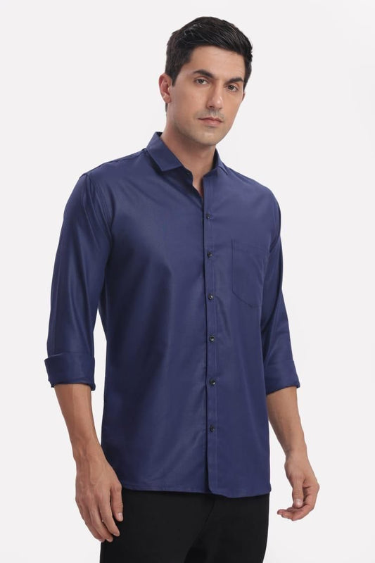 Man wearing a blue shirt on a white background