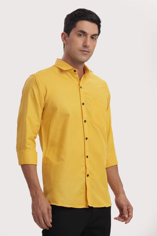Man wearing a yellow shirt on a white background