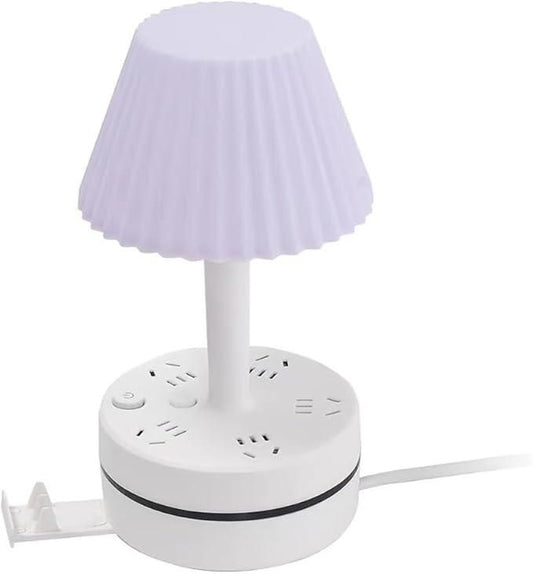 White lamp with pleated shade on a white background