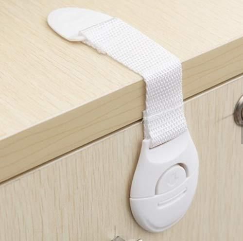 White cabinet lock on a wooden drawer