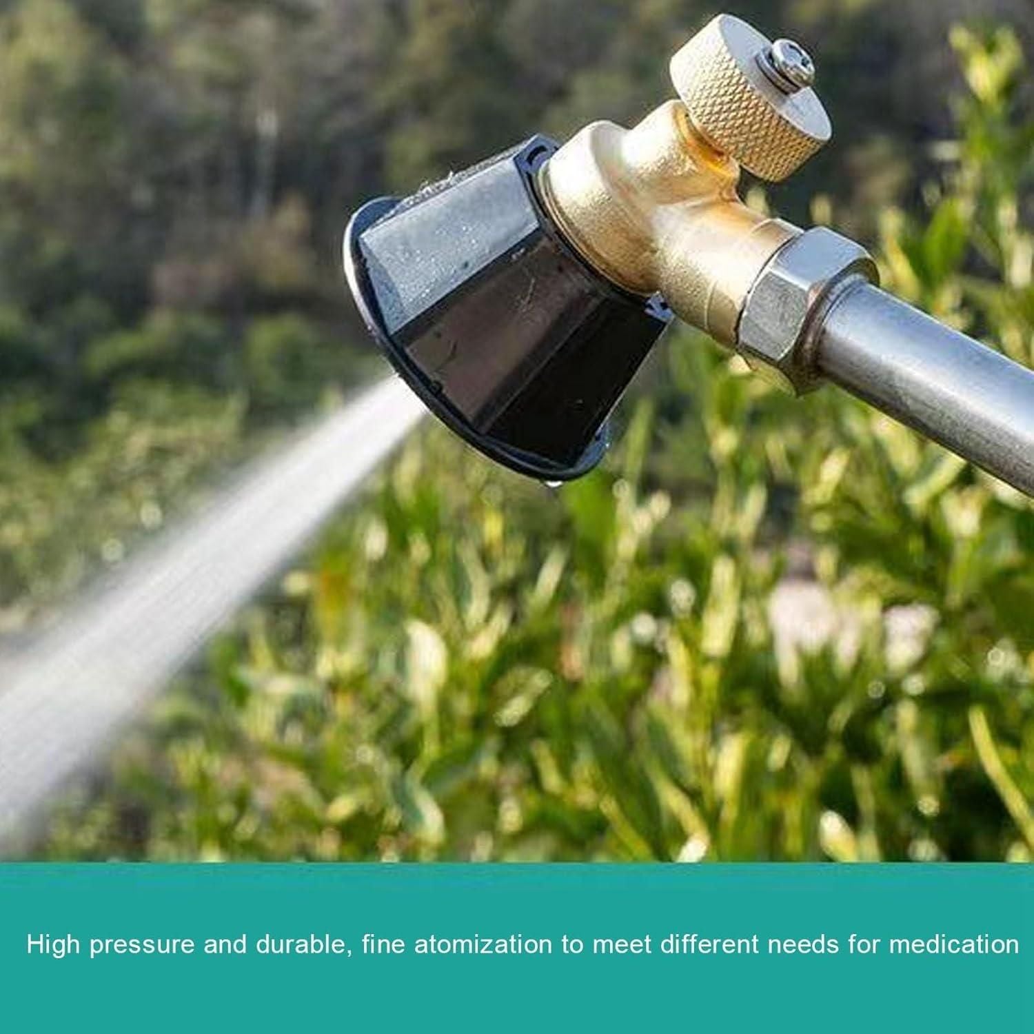 Garden hose nozzle with water spraying on a blurred green background