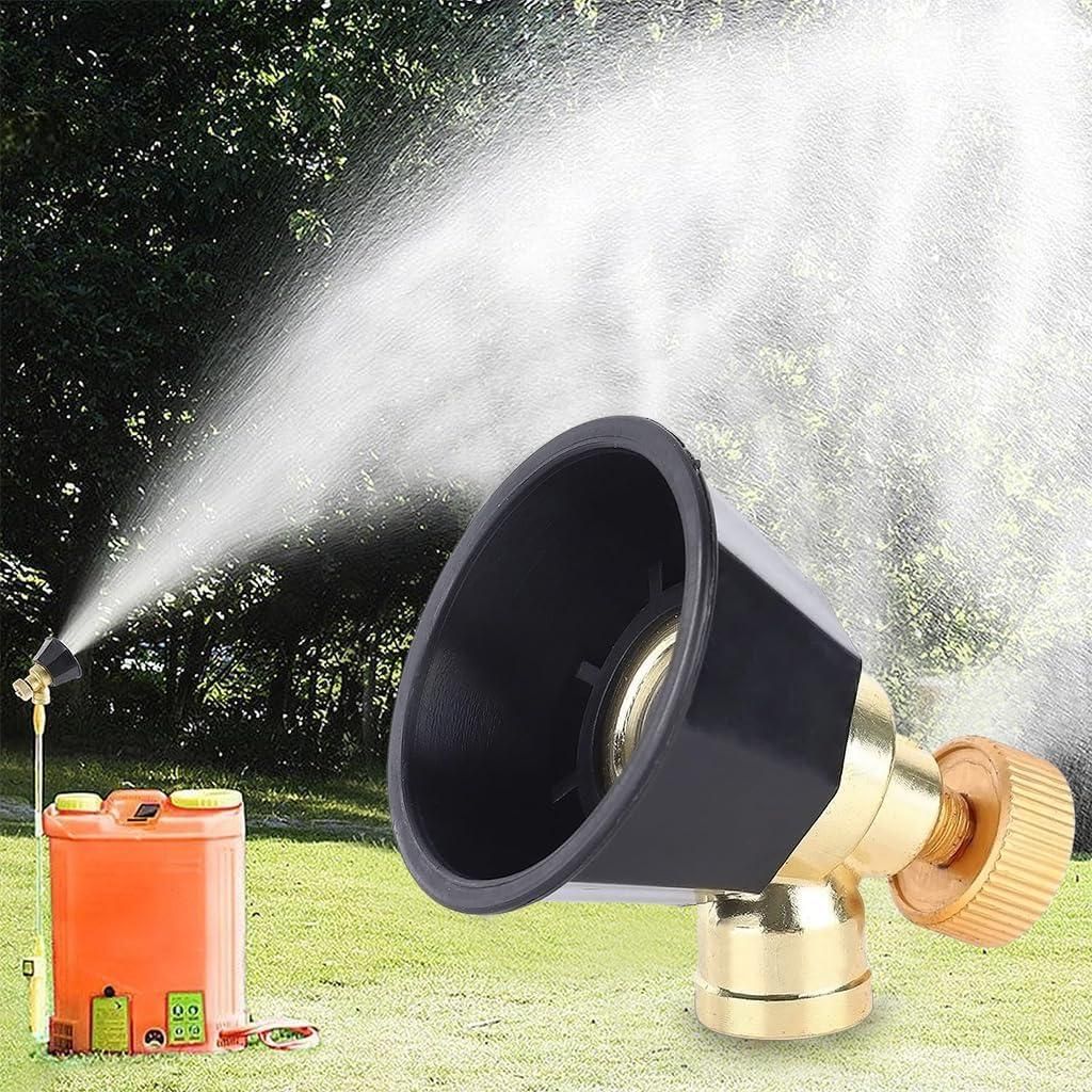 Garden spray nozzle spraying water with a grassy background