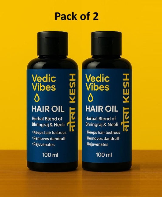 Two bottles of Vedic Vibes hair oil on a yellow background